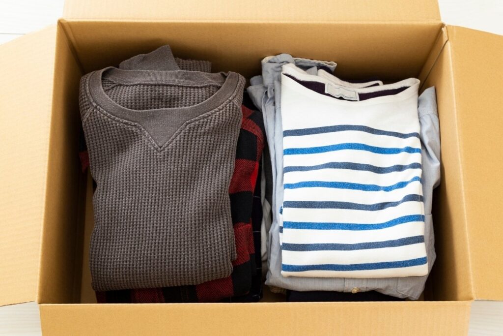 Clothes folded and packed inside a box.